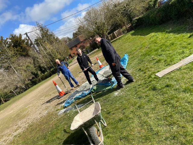 The St James South Elmham Village Hall Z Team members laying foundations for a new storage hut